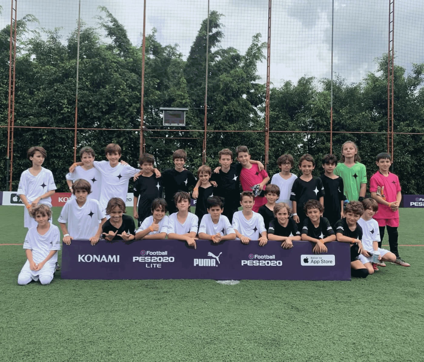Both sides behind the Konami board with eFootball PES 2020 and Puma