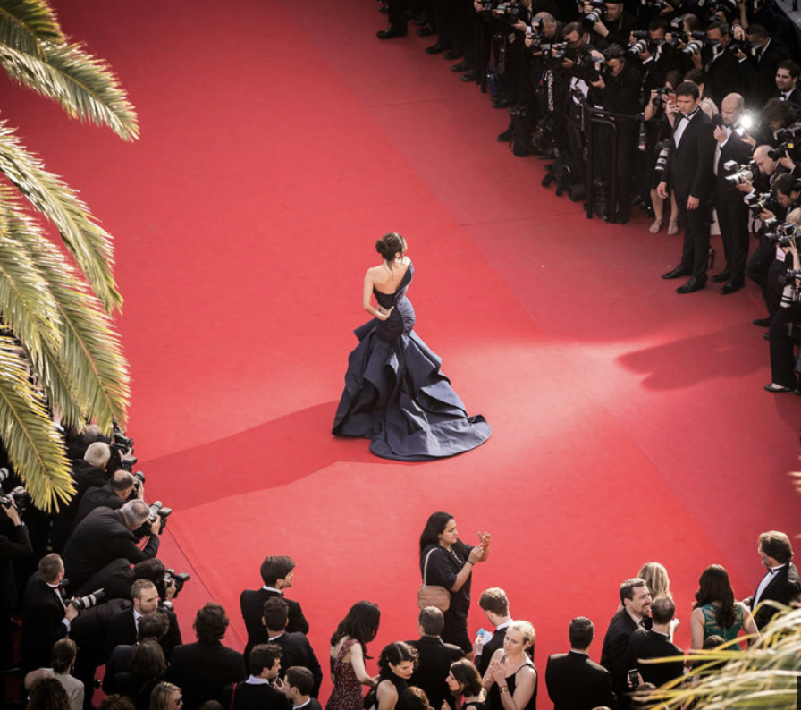 The Cannes red carpet seen from above, ringed by photographers