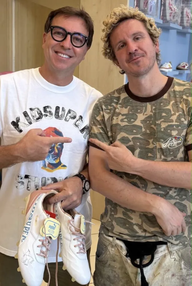 Fabio Brancatelli, holding KidSuper × Puma boots, and Colm Dillane at the Brooklyn store