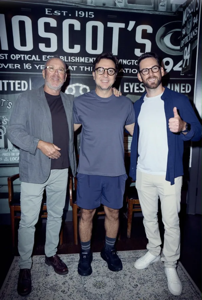 Harvey Moscot, Fabio Brancatelli and Zack Moscot in front of the historic Moscot sign